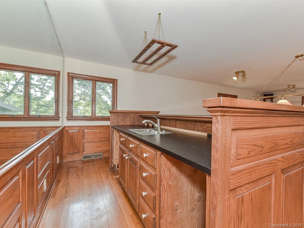 402 3 Knotts Road Monroe, NC 28112 - Photo 20 of 48 a kitchen that has a sink and a stove
