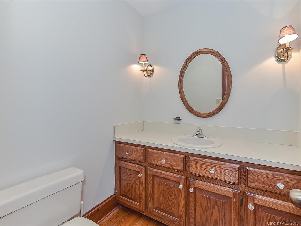 402 3 Knotts Road Monroe, NC 28112 - Photo 23 of 48 a bathroom with a sink and a mirror