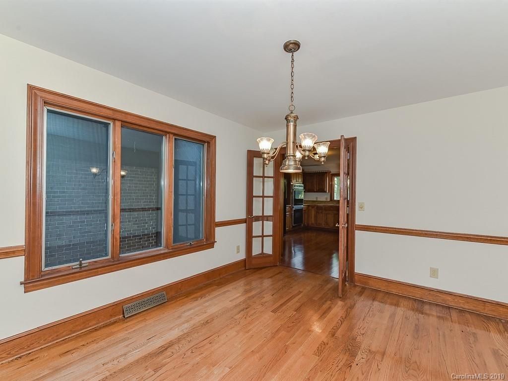 402 3 Knotts Road Monroe, NC 28112 - Photo 5 of 48 a view of empty room with wooden floor and kitchen view