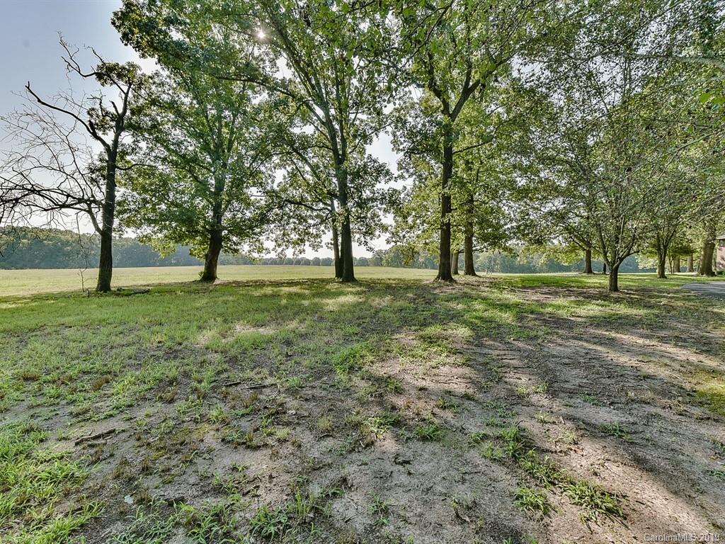 402 3 Knotts Road Monroe, NC 28112 - Photo 46 of 48 a big yard with lots of trees