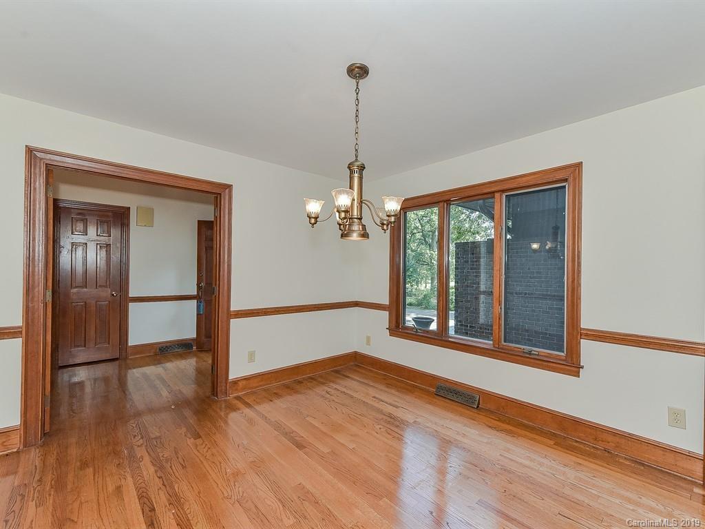 402 3 Knotts Road Monroe, NC 28112 - Photo 6 of 48 a view of a room with wooden floor chandelier and windows