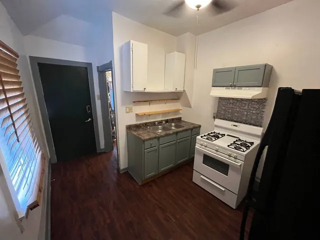 a kitchen with a stove and a refrigerator