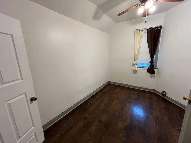 a view of room with wooden floor and window