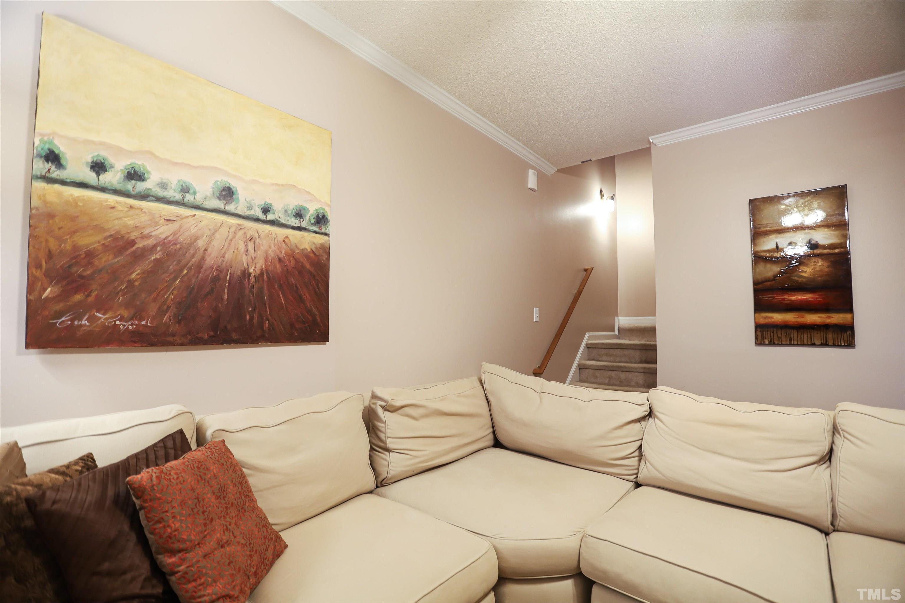 4102 Beaufain Street Raleigh, NC 27604 - Photo 16 of 28 a living room with furniture and a floor to ceiling window