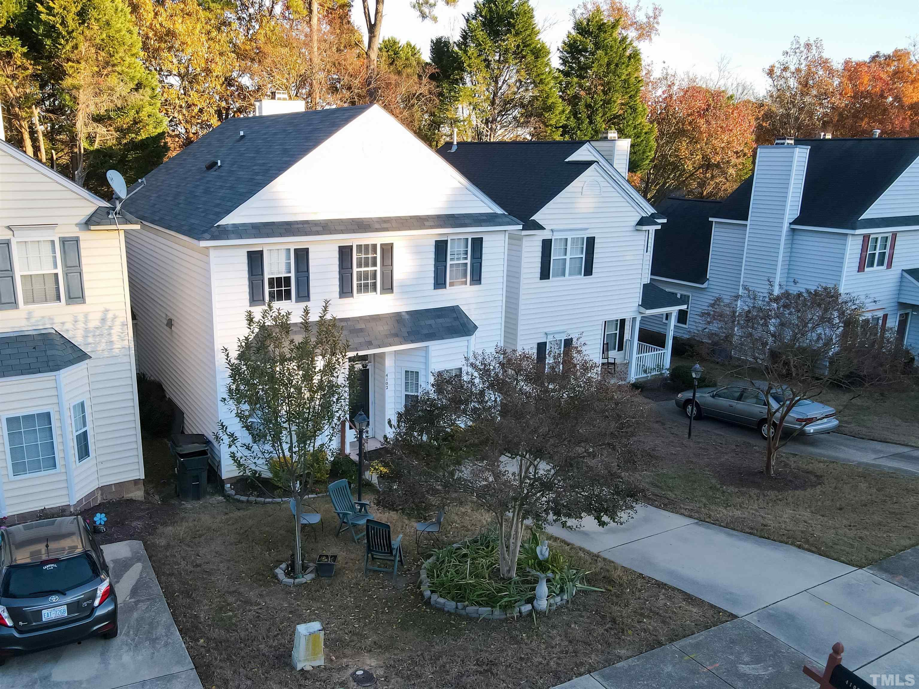 4102 Beaufain Street Raleigh, NC 27604 - Photo 3 of 28 a front view of a house with a yard patio and fire pit