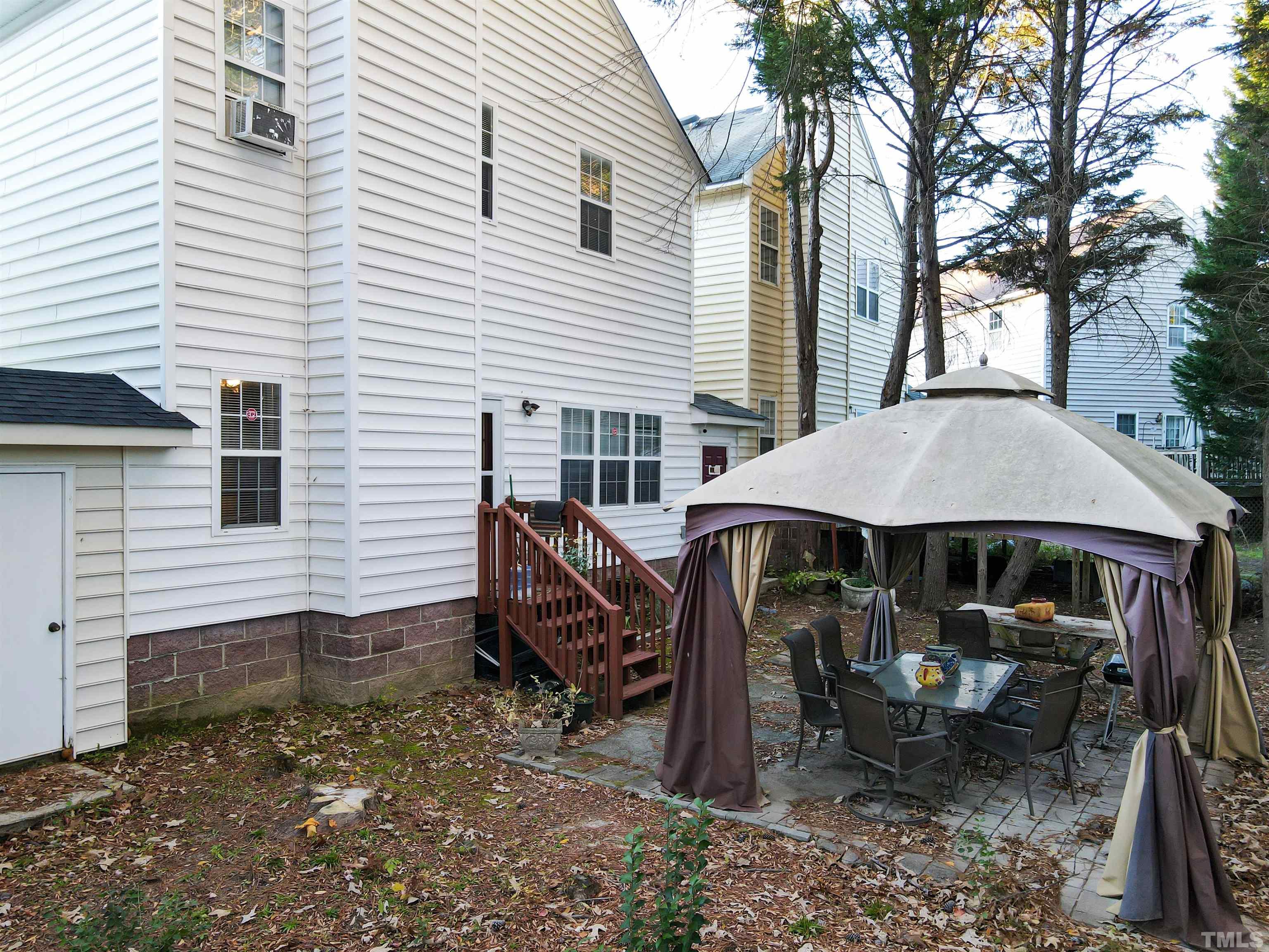 4102 Beaufain Street Raleigh, NC 27604 - Photo 26 of 28 a view of a house with backyard and sitting area