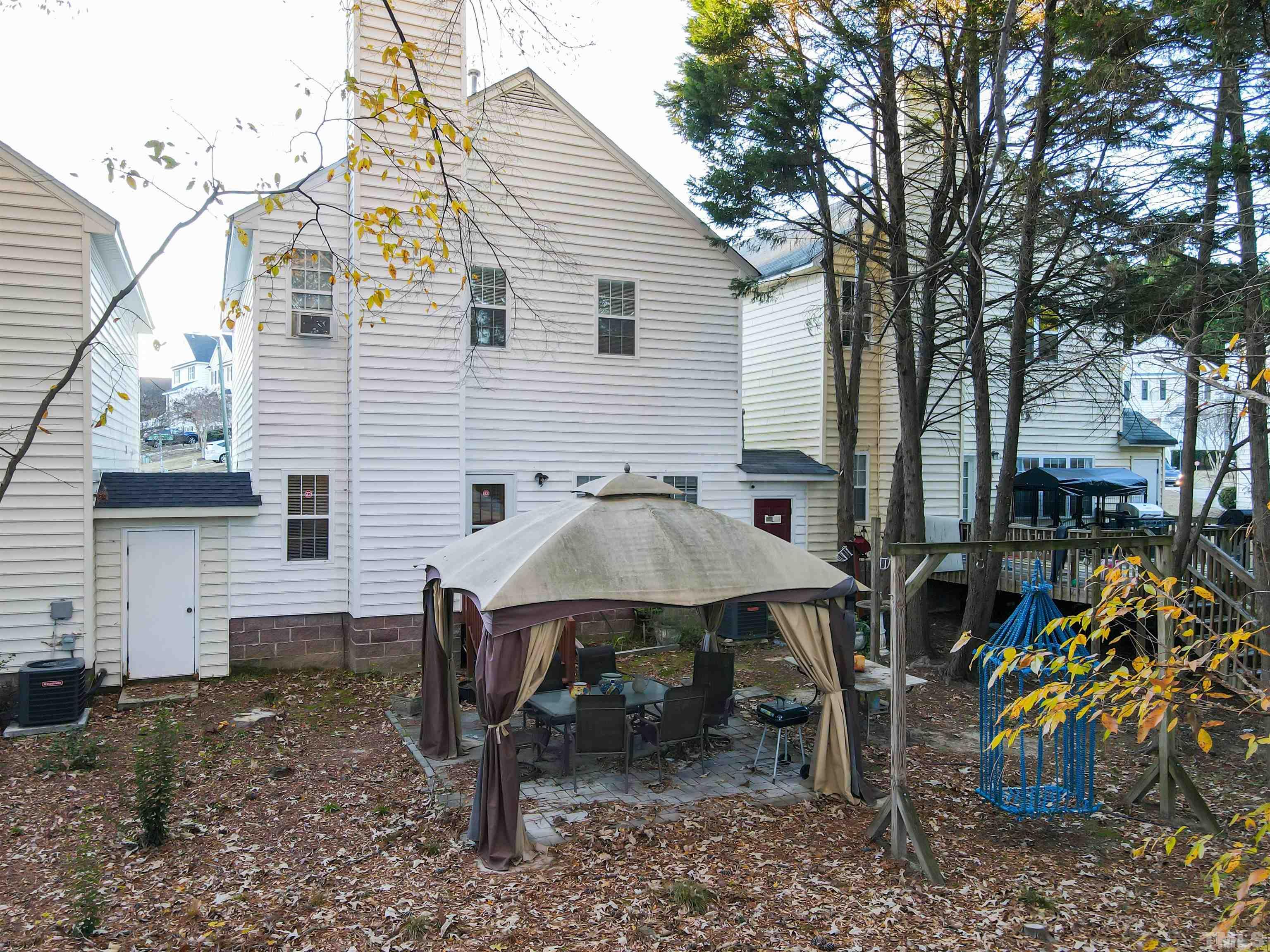 4102 Beaufain Street Raleigh, NC 27604 - Photo 28 of 28 a view of a house with backyard and sitting area