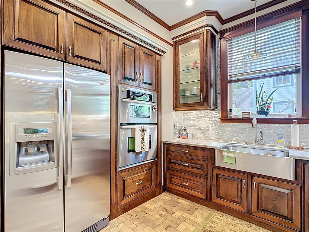 705 Southeast 5th Street Ocala, FL 34471 - Photo 14 of 41 a kitchen with stainless steel appliances granite countertop a refrigerator and a sink