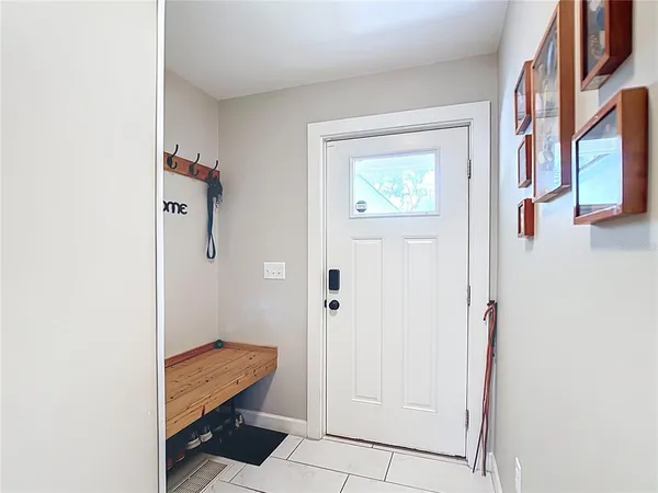 a view of a hallway with closet and bathroom