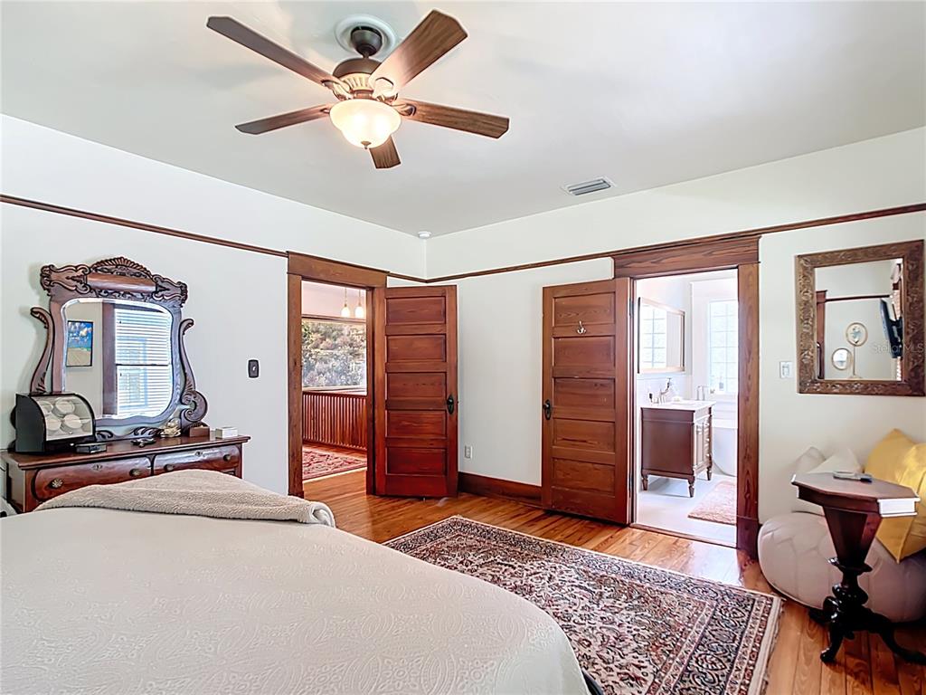 705 Southeast 5th Street Ocala, FL 34471 - Photo 21 of 41 a bedroom with a bed and dresser with chair