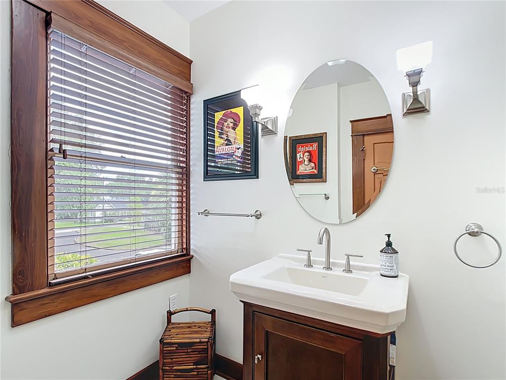 705 Southeast 5th Street Ocala, FL 34471 - Photo 28 of 41 a bathroom with a sink and a mirror