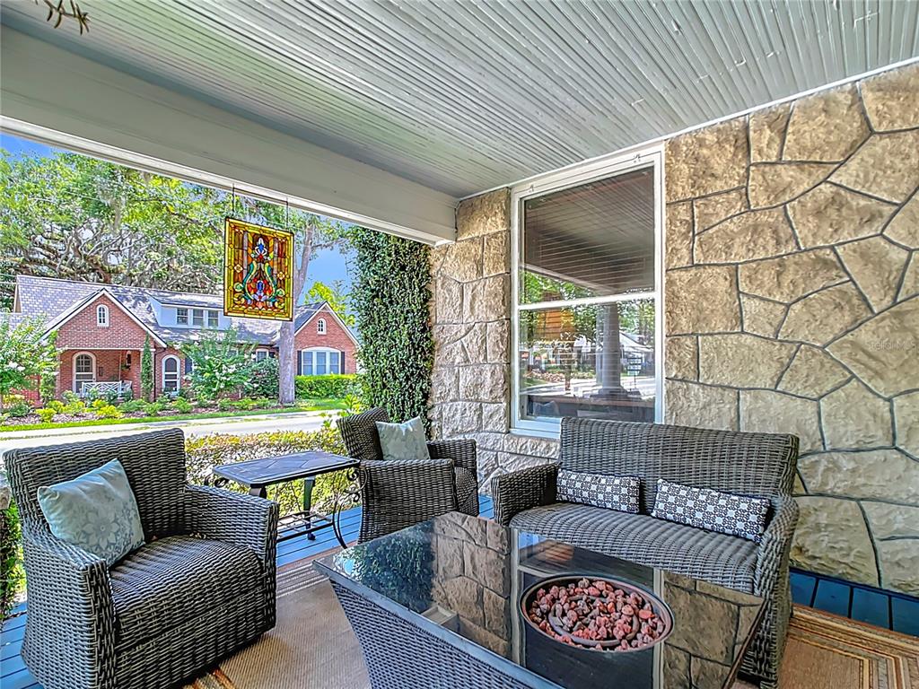 705 Southeast 5th Street Ocala, FL 34471 - Photo 3 of 41 a outdoor living space with furniture and a flat screen tv