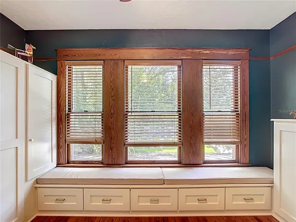 a view of a dining room with furniture window and outside view