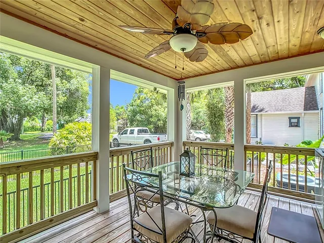 a view of a dining room with furniture wooden floor and chandelier