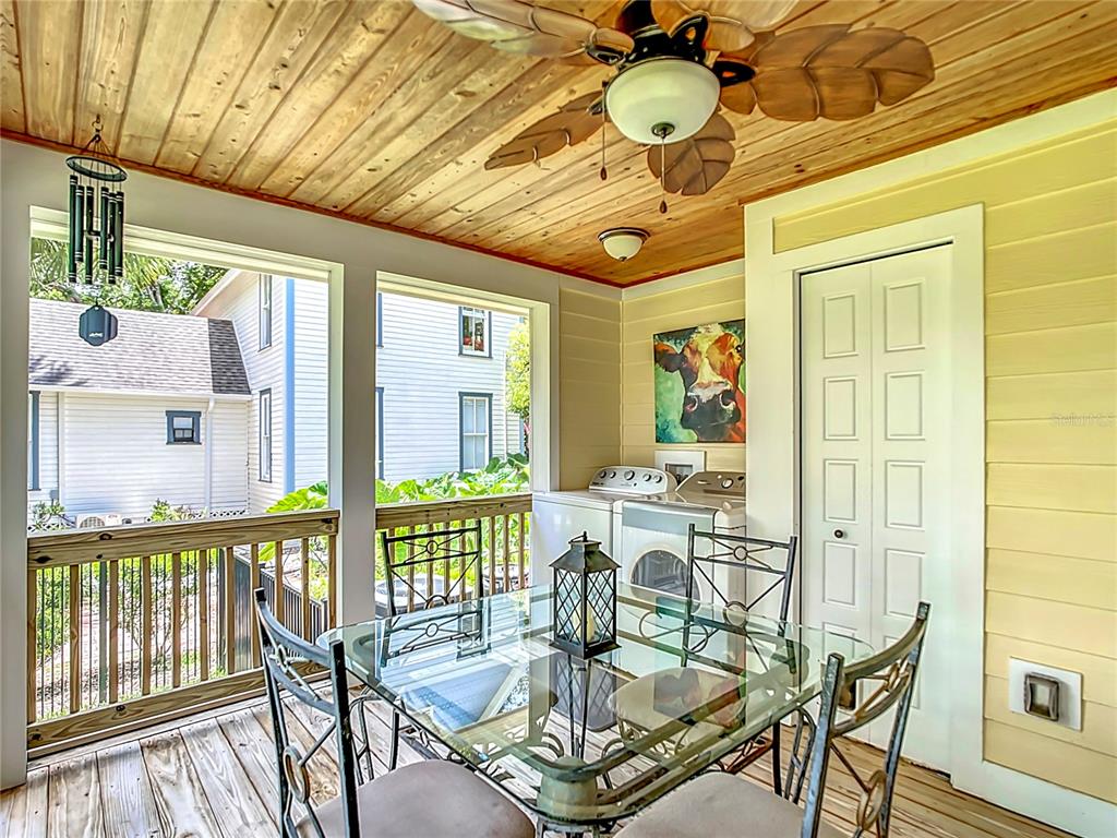705 Southeast 5th Street Ocala, FL 34471 - Photo 34 of 41 a view of a dining room with furniture wooden floor and chandelier