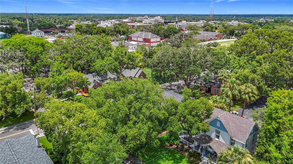 705 Southeast 5th Street Ocala, FL 34471 - Photo 40 of 41 an aerial view of residential houses with outdoor space and trees
