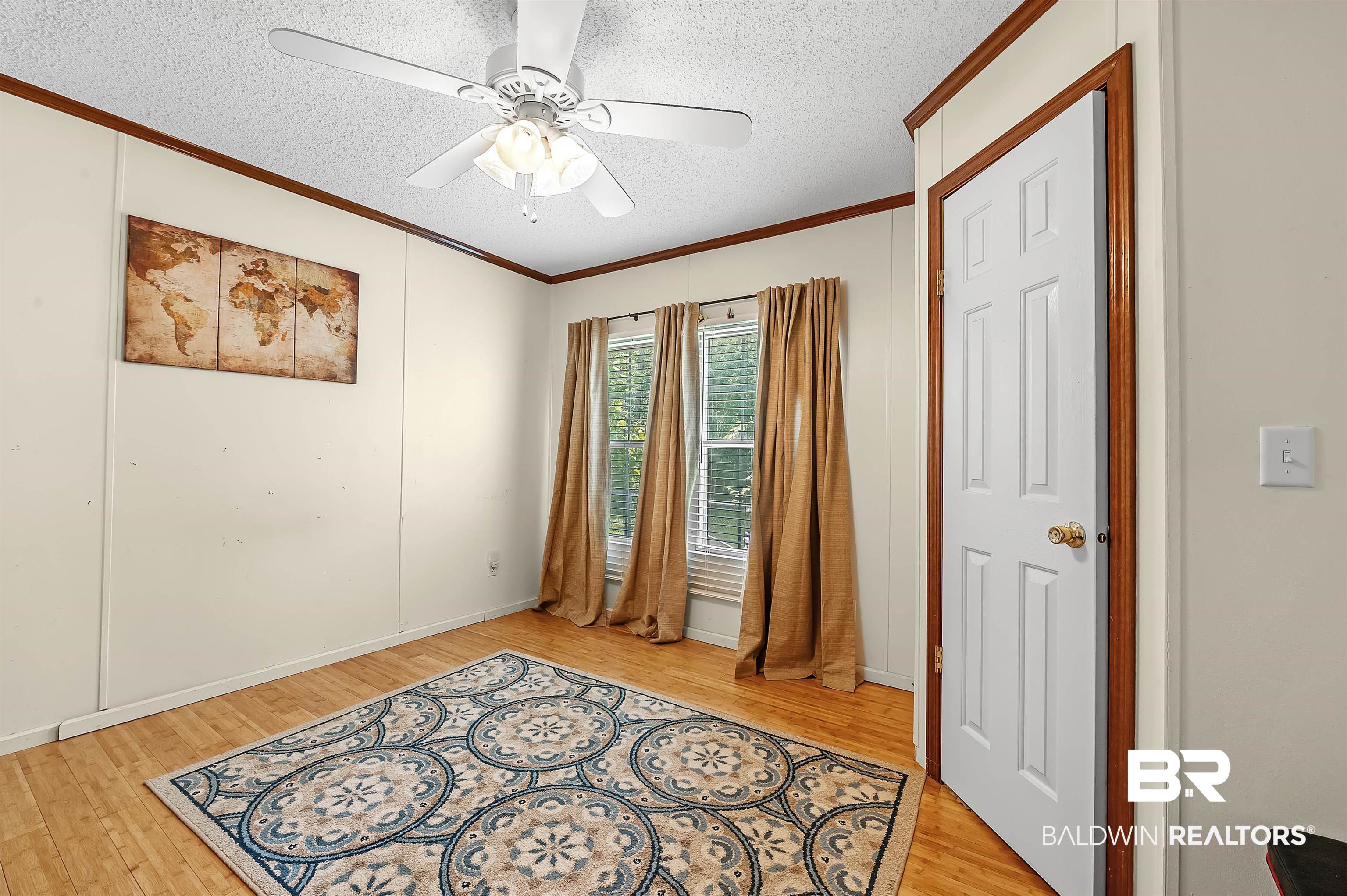 10970 Stucki Road Elberta, AL 36530 - Photo 32 of 56 Interior space with ceiling fan, crown molding, Bamboo flooring, and a textured ceiling