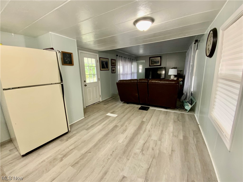 4199 Massillon Road, Unit 223 Uniontown, OH 44685 - Photo 7 of 20 Kitchen with white fridge and light hardwood floors