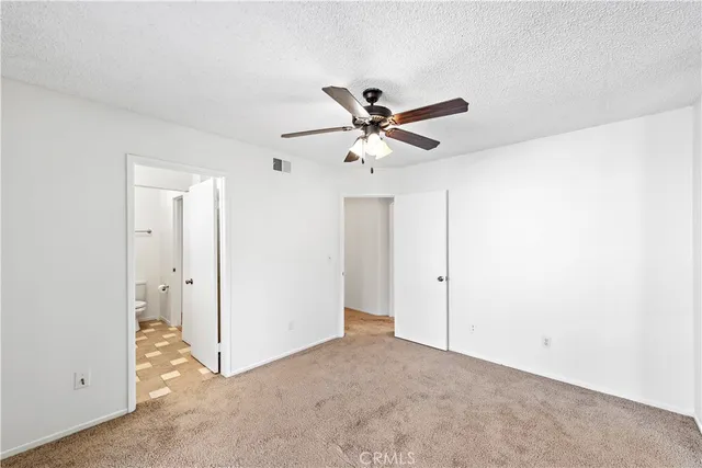a view of a livingroom with a ceiling fan