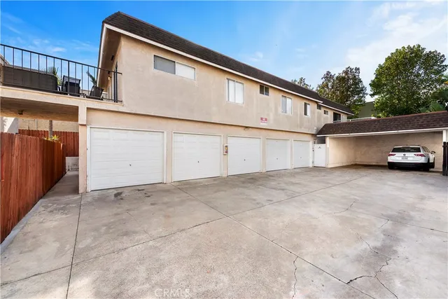 an aerial view of a residential houses with city view