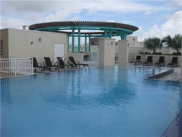 7290 Southwest 90th Street, Unit 701 Miami, FL 33156 - Photo 15 of 16 a view of a chairs and table in the patio