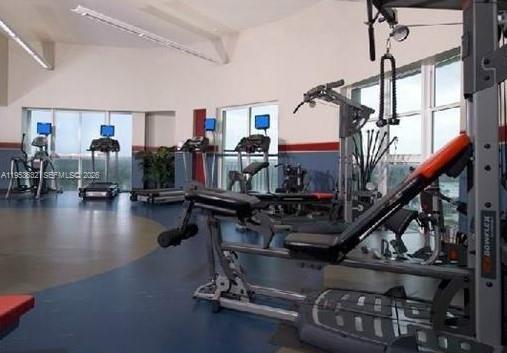 7290 Southwest 90th Street, Unit 701 Miami, FL 33156 - Photo 16 of 16 a gym room with lots of gym equipment
