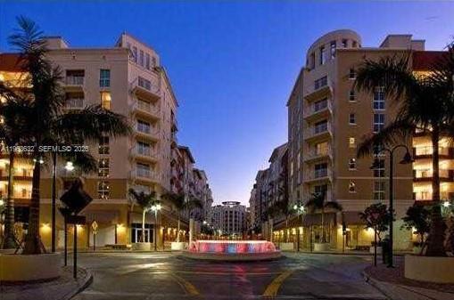 7290 Southwest 90th Street, Unit 701 Miami, FL 33156 - Photo 2 of 16 a view of a building with a street