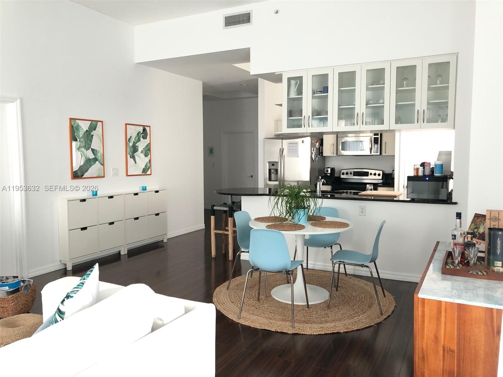 7290 Southwest 90th Street, Unit 701 Miami, FL 33156 - Photo 6 of 16 a living room with fireplace furniture and a large window