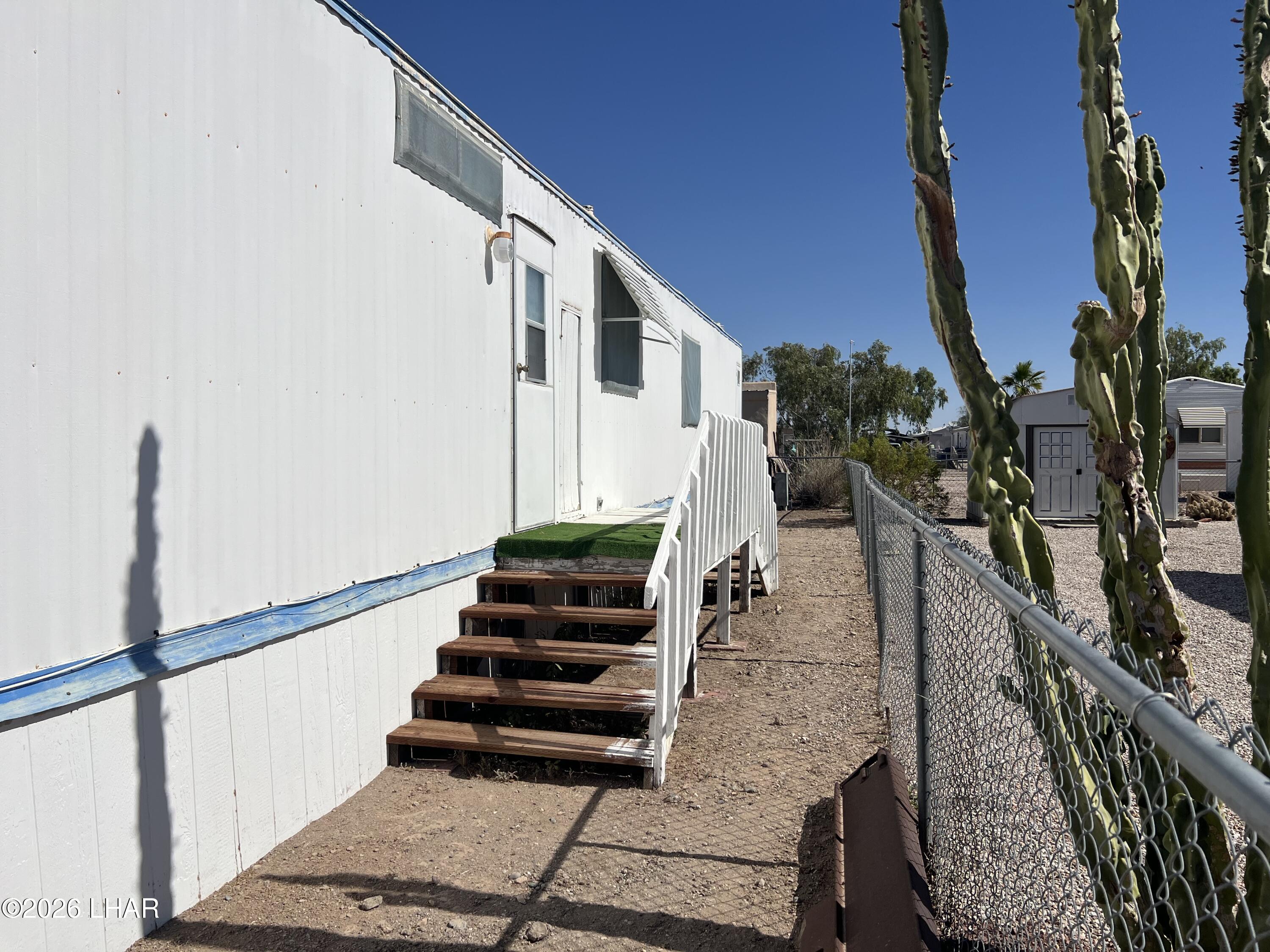 776 Granada Drive Quartzsite, AZ 85346 - Photo 8 of 39 Back door has stairs to either side