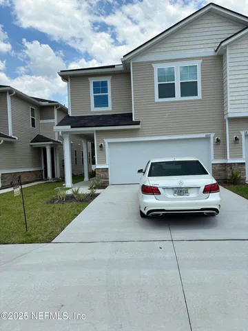 a car parked in front of a house