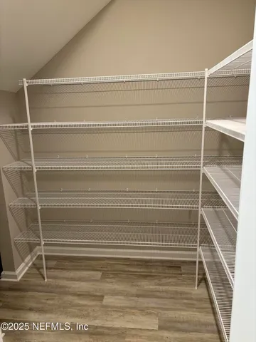 a view of a room with stairs and a rug