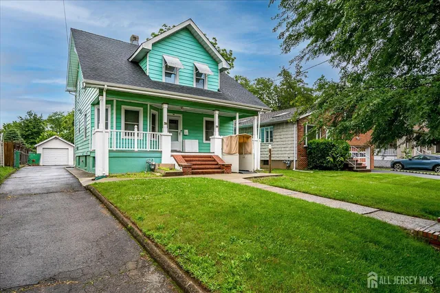 a front view of a house with a yard and porch