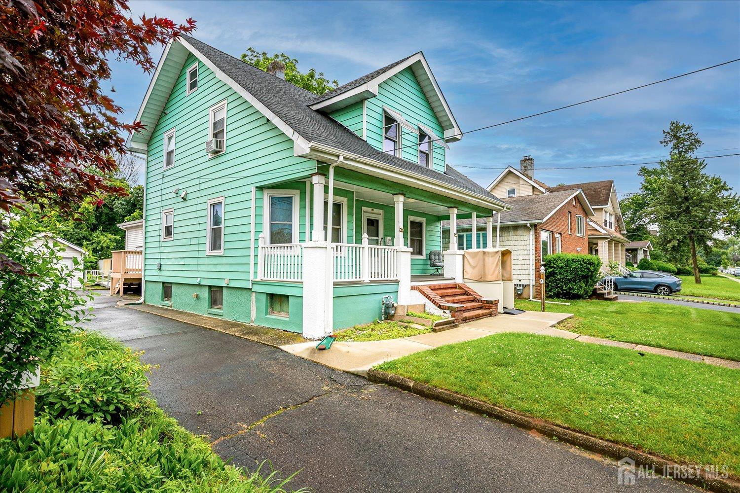 311 Prospect Avenue Dunellen, NJ 08812 - Photo 2 of 42 a view of a house with backyard porch and sitting area