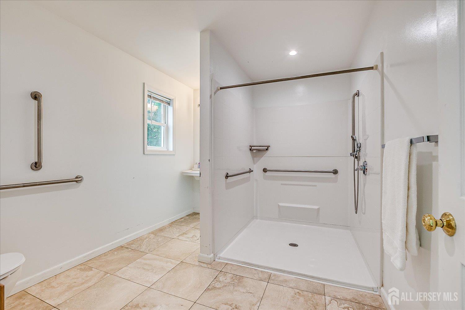 311 Prospect Avenue Dunellen, NJ 08812 - Photo 21 of 42 a bathroom with a shower and a toilet