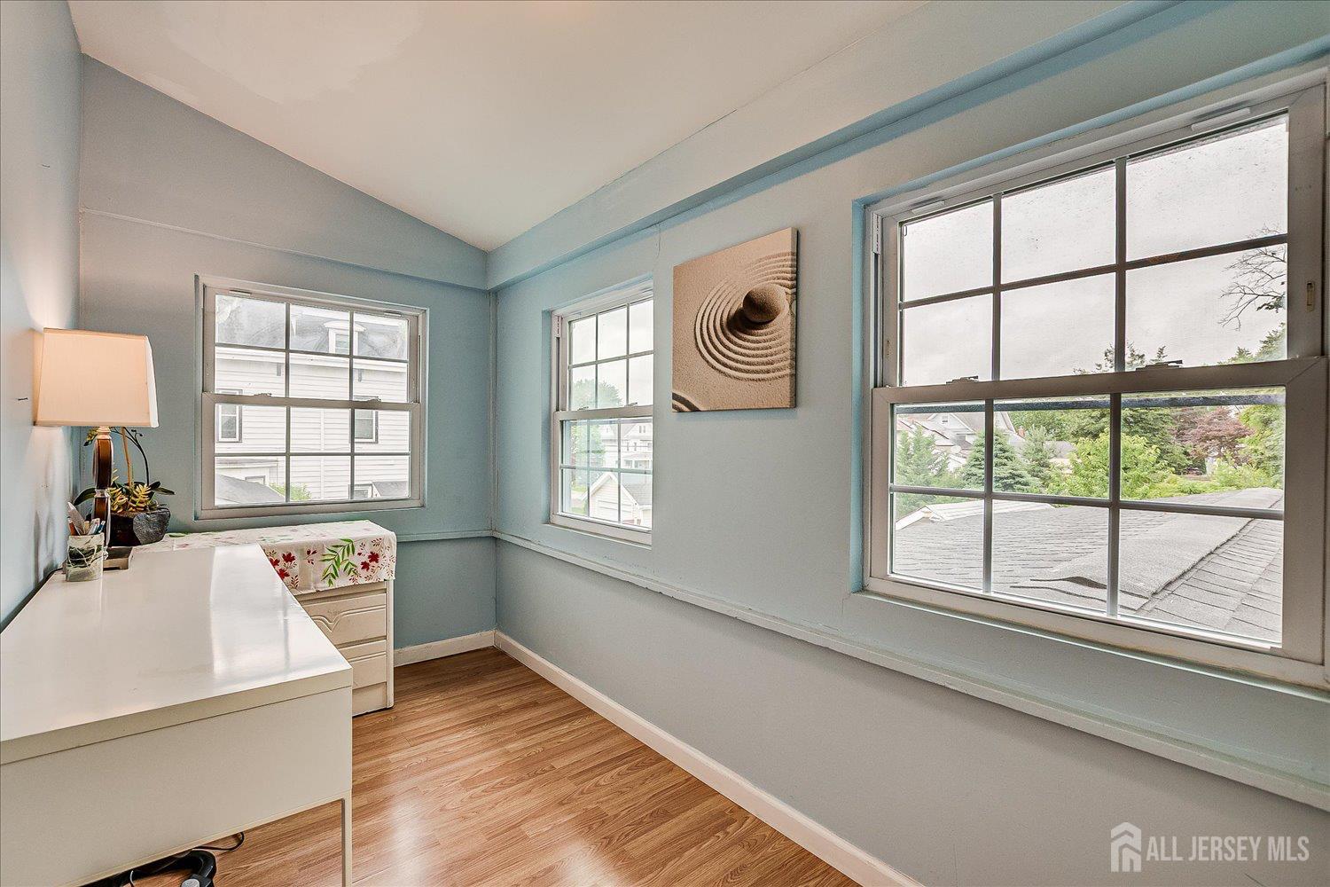 311 Prospect Avenue Dunellen, NJ 08812 - Photo 25 of 42 a hallway with a bed and a large window