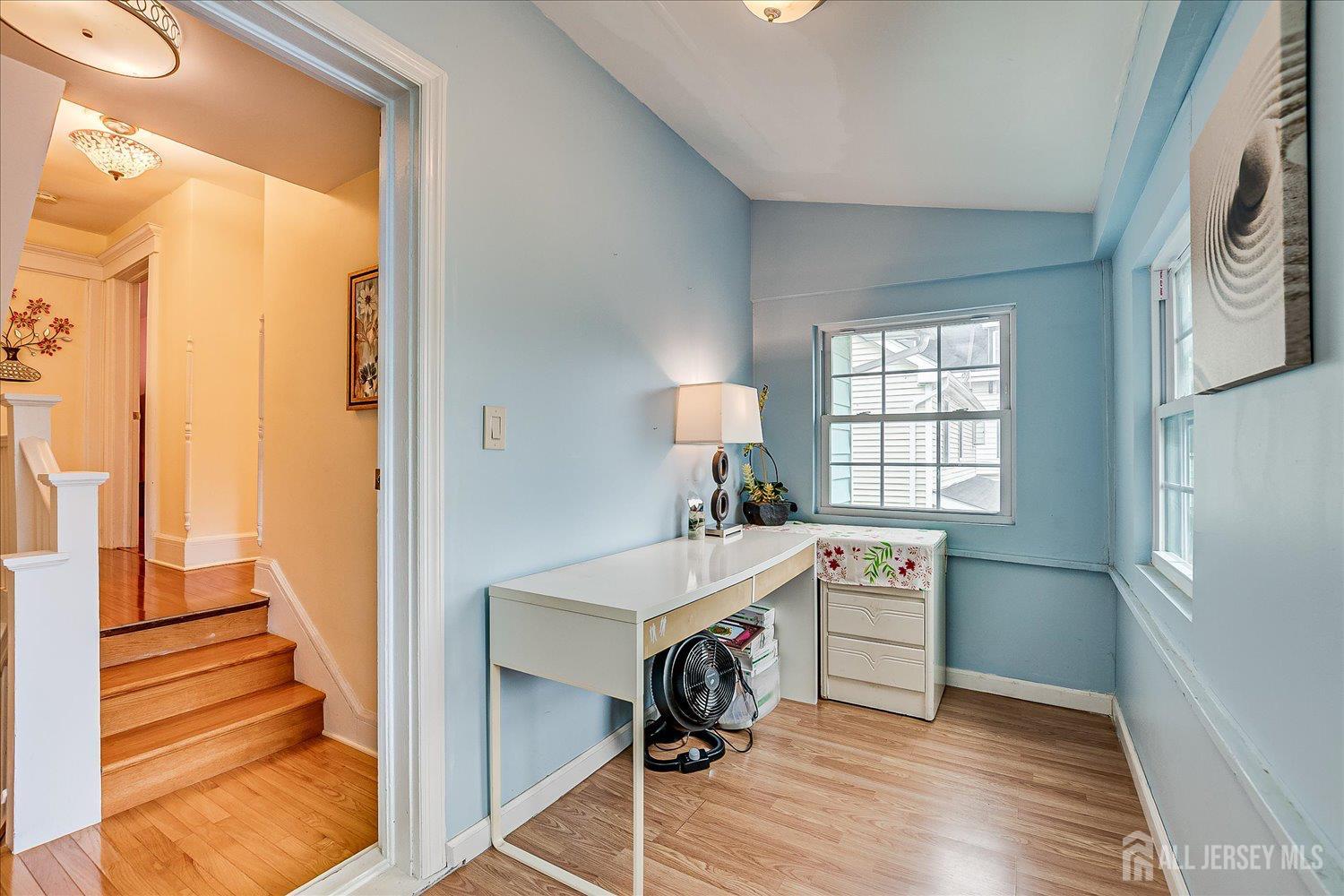311 Prospect Avenue Dunellen, NJ 08812 - Photo 26 of 42 a room with a window and wooden floor