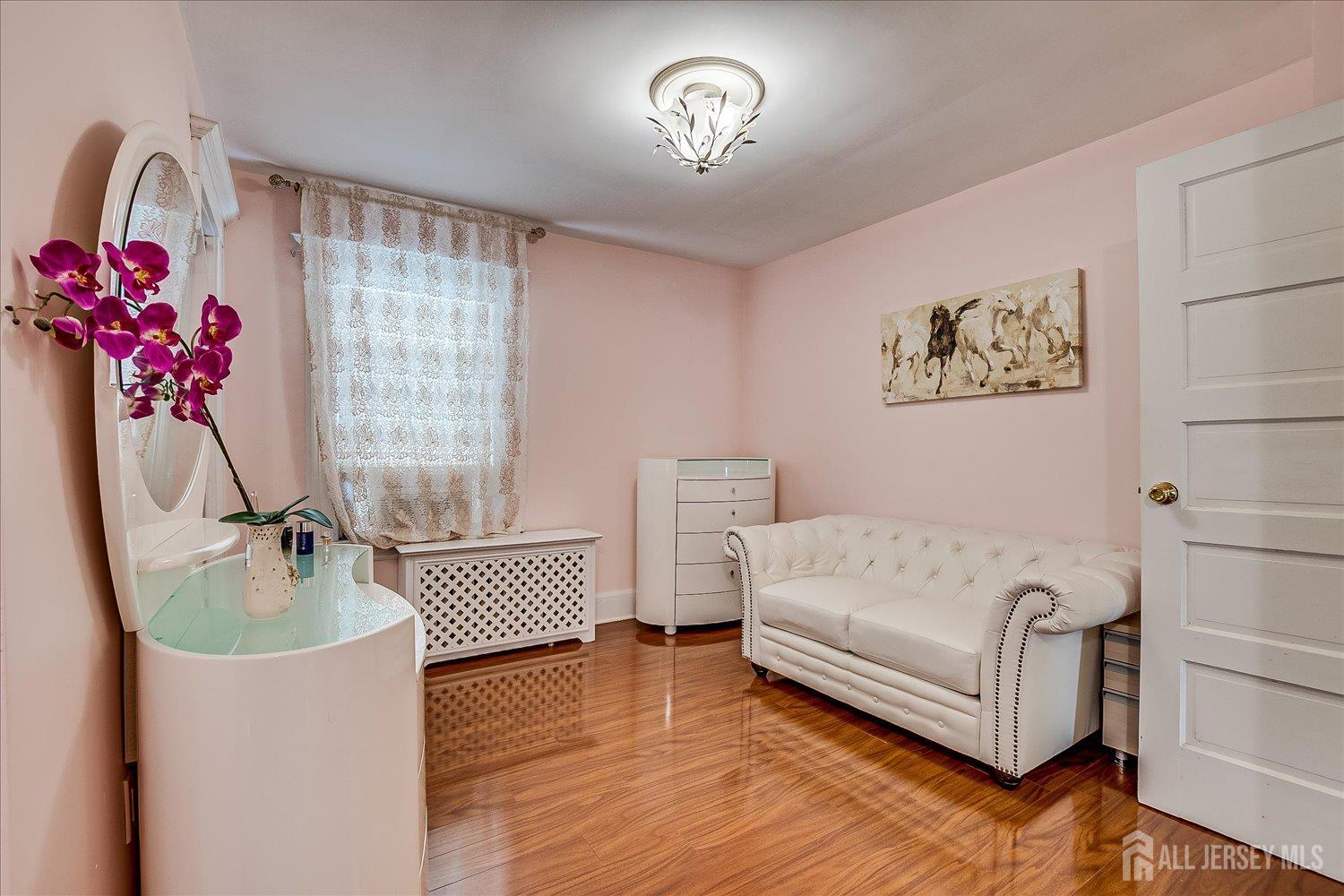311 Prospect Avenue Dunellen, NJ 08812 - Photo 30 of 42 a living room with furniture and a window