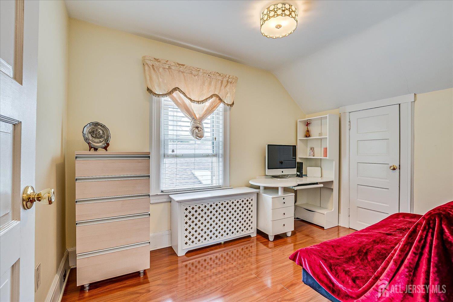 311 Prospect Avenue Dunellen, NJ 08812 - Photo 32 of 42 a living room with a bed furniture and a window