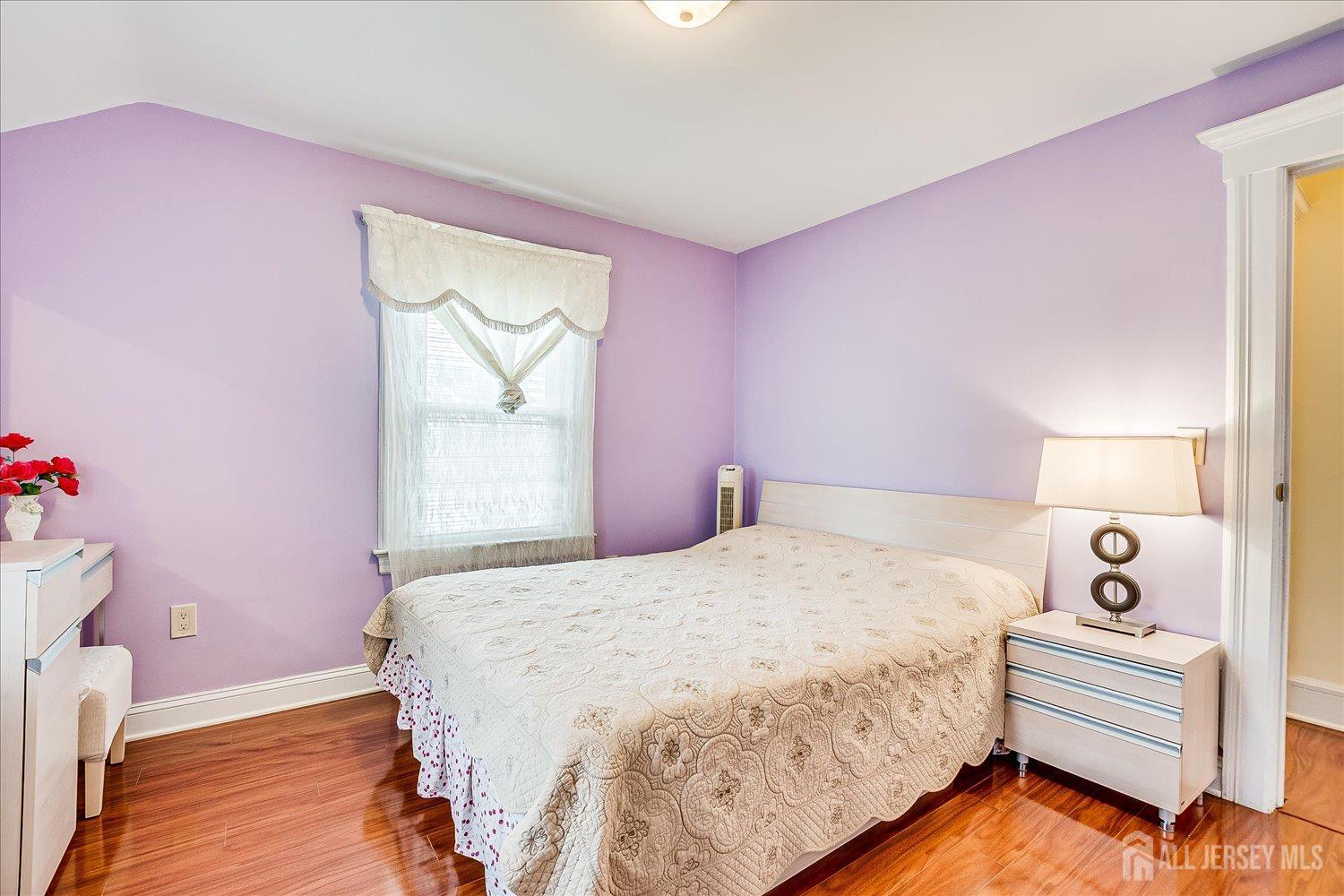 311 Prospect Avenue Dunellen, NJ 08812 - Photo 35 of 42 a bedroom with a bed and a window
