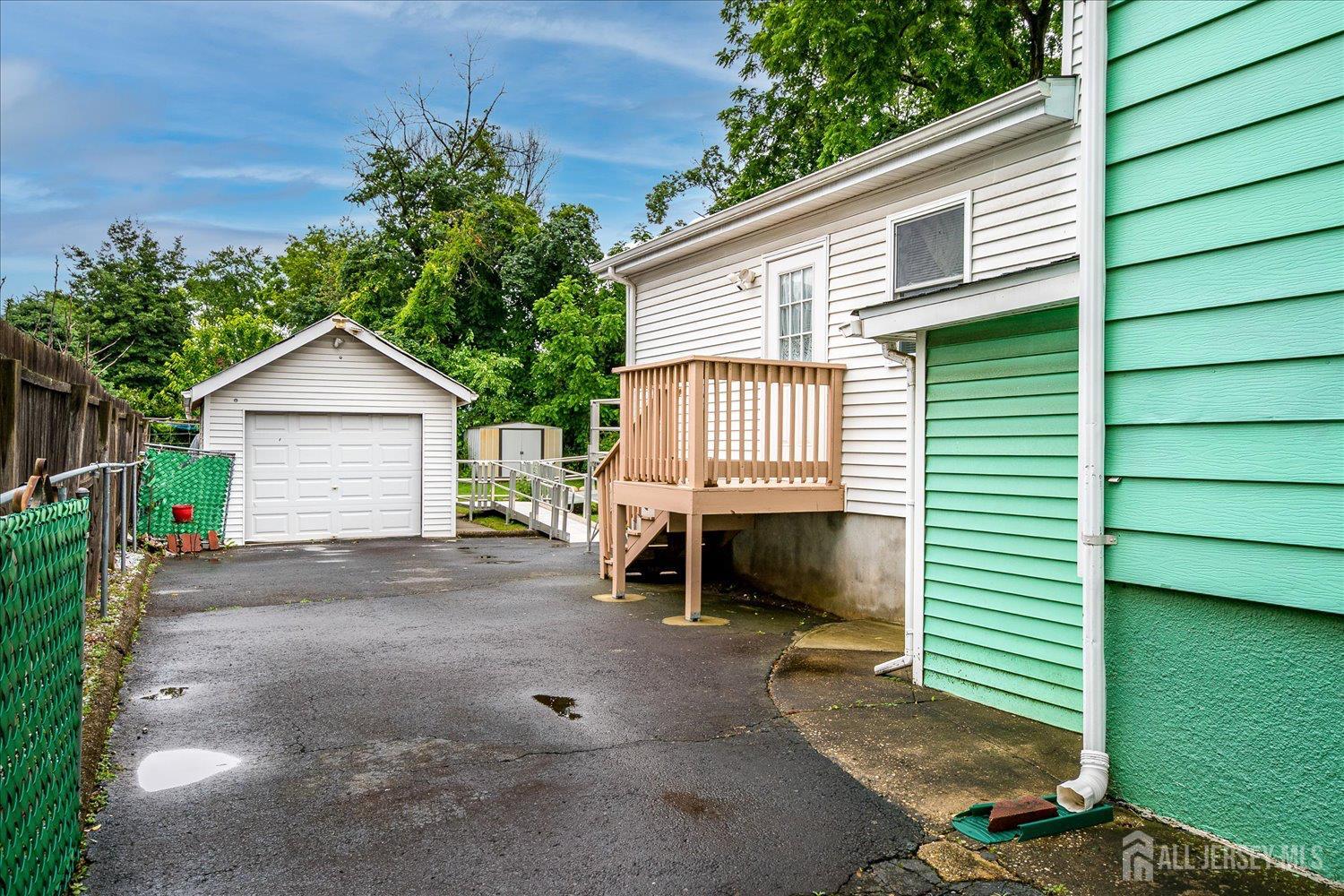 311 Prospect Avenue Dunellen, NJ 08812 - Photo 37 of 42 a view of a house with a backyard and a garden