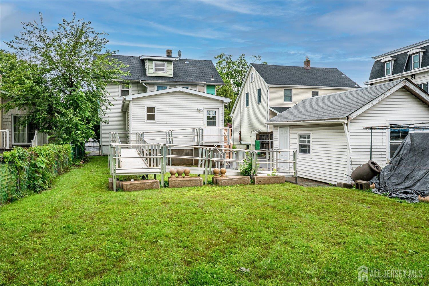 311 Prospect Avenue Dunellen, NJ 08812 - Photo 38 of 42 a view of a house with a yard and sitting area