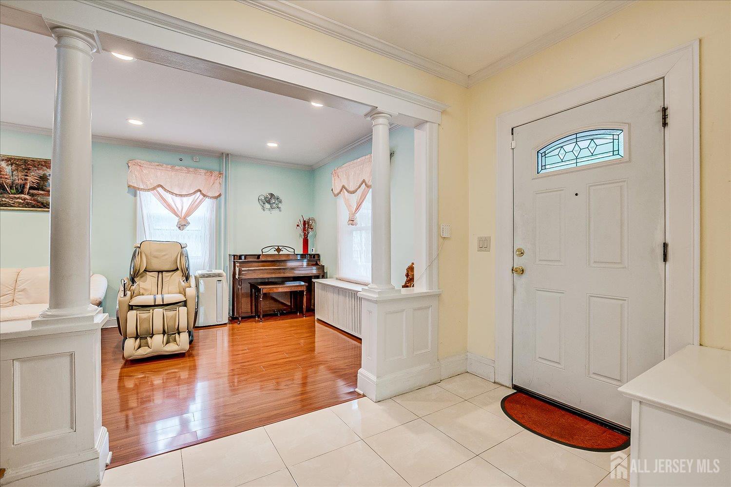 311 Prospect Avenue Dunellen, NJ 08812 - Photo 5 of 42 a living room with furniture and a wooden floor