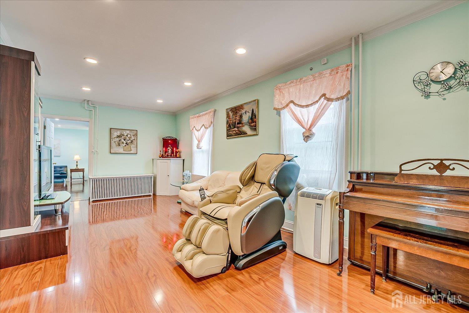 311 Prospect Avenue Dunellen, NJ 08812 - Photo 7 of 42 a living room with furniture and a wooden floor