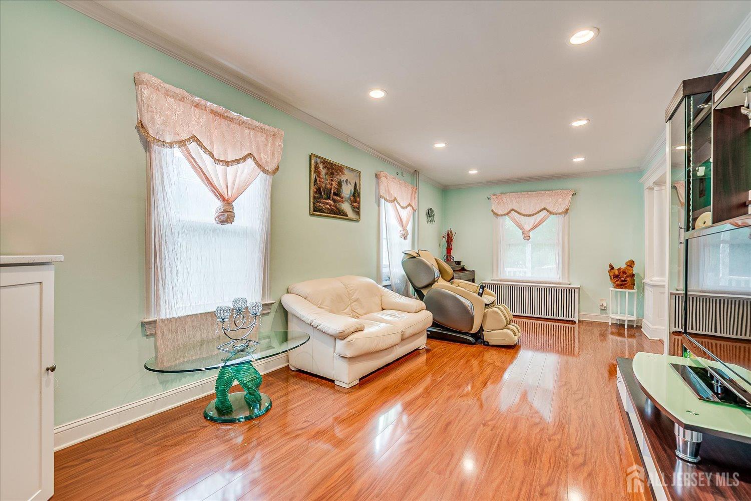 311 Prospect Avenue Dunellen, NJ 08812 - Photo 9 of 42 a living room with furniture and a wooden floor