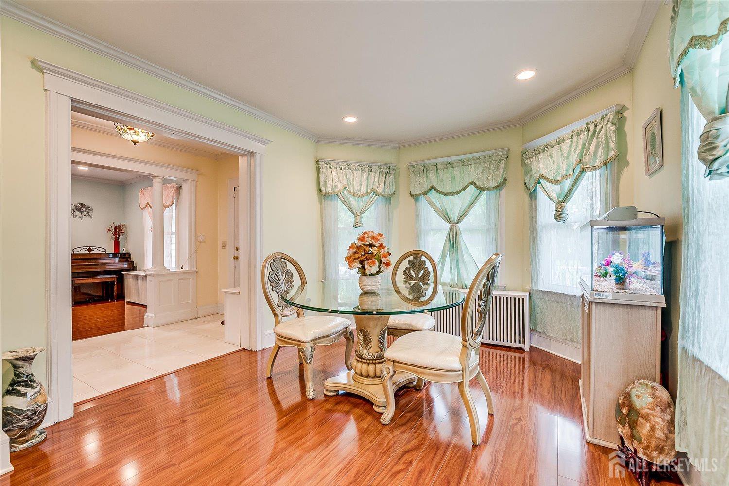 311 Prospect Avenue Dunellen, NJ 08812 - Photo 10 of 42 a dining room with furniture and wooden floor