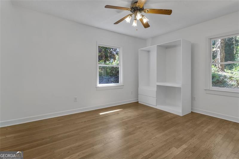 722 Northern Clarkston, GA 30021 - Photo 17 of 31 a view of an empty room with a window and wooden floor