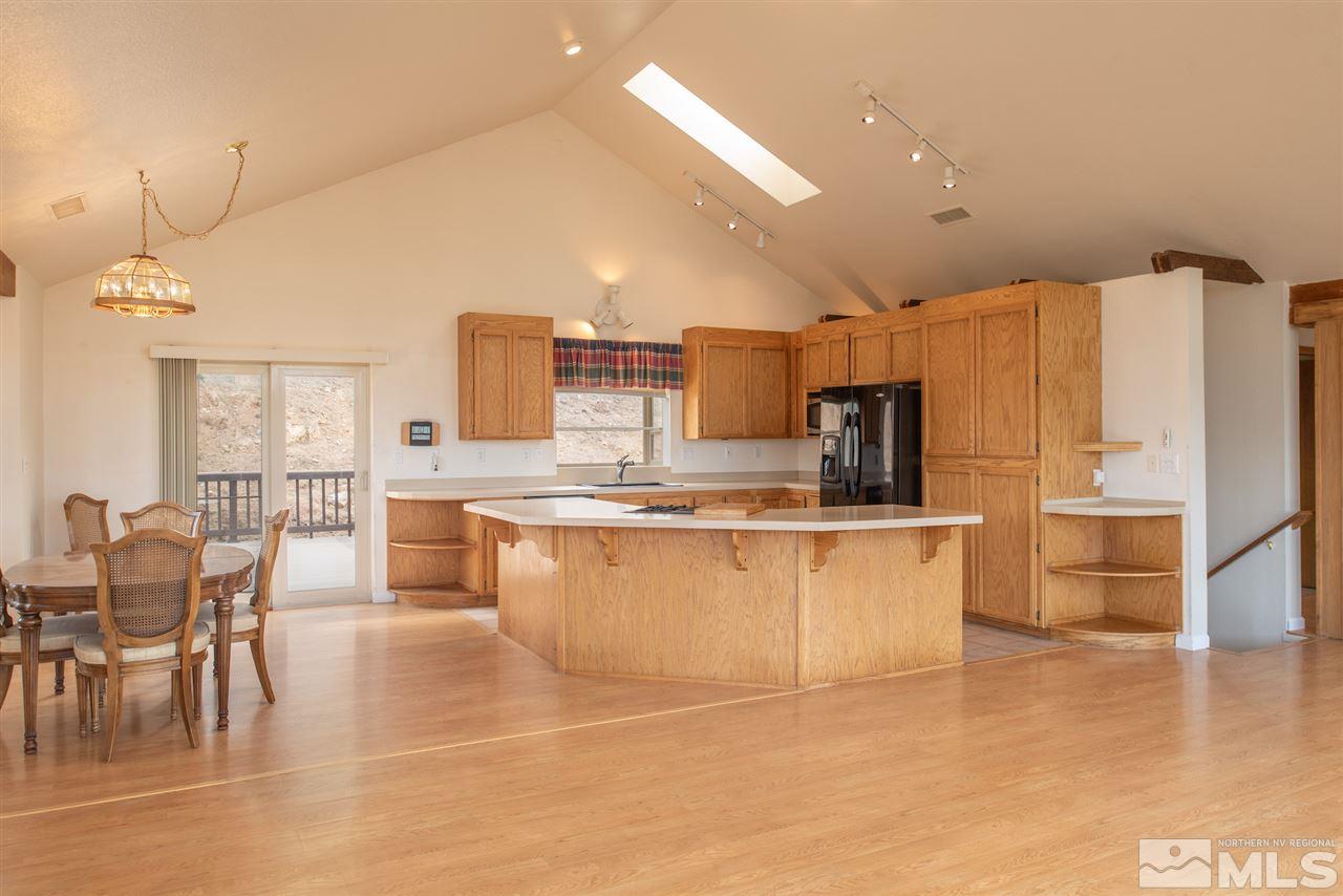 15505 Minnetonka Circle Reno, NV 89521 - Photo 6 of 25 a kitchen with stainless steel appliances a refrigerator and microwave