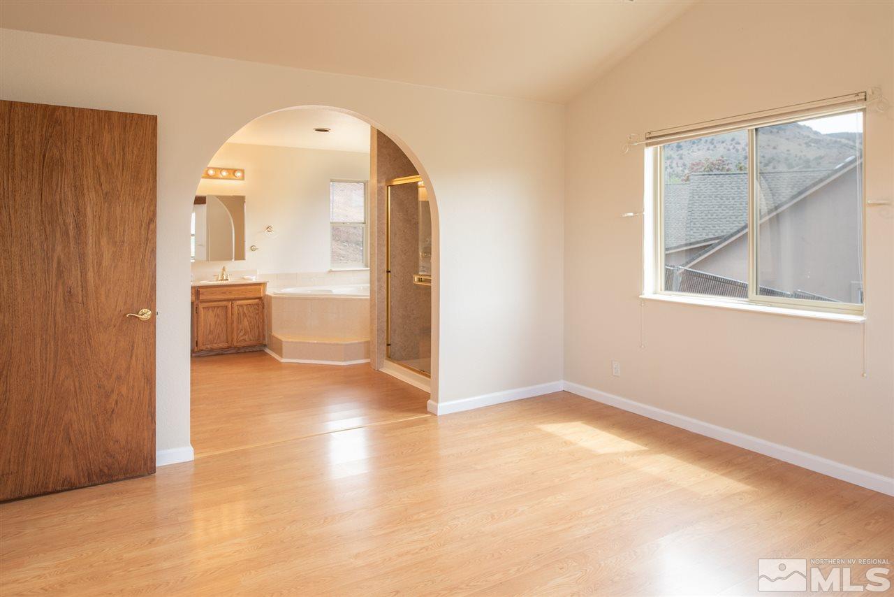 15505 Minnetonka Circle Reno, NV 89521 - Photo 8 of 25 an empty room with a bathroom and mirror