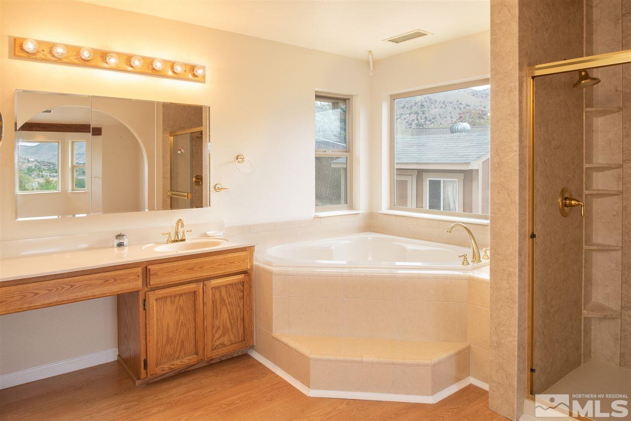 15505 Minnetonka Circle Reno, NV 89521 - Photo 9 of 25 a bathroom with a tub sink and mirror