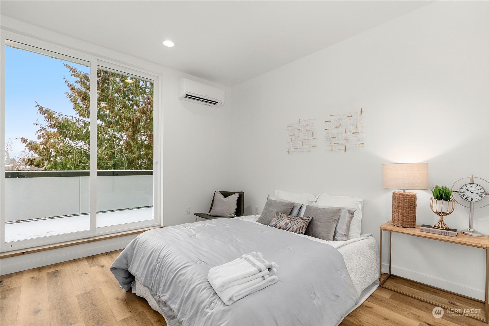 9429 18th Avenue Southwest, Unit B Seattle, WA 98106 - Photo 14 of 28 a bedroom with a bed and window